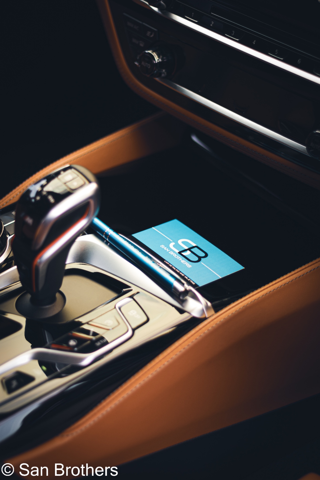 SanBrothers card inside a detailed BMW interior
